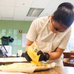 (Photo by Luisa Loi)
Zoe Castillo fills the deviled eggs.