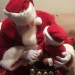 (Photo provided)
Santa Claus holds a baby Santa Claus.