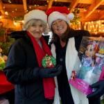 (Photo by David Welton)
Dorothy Anderson and Tamara Knapp hold up free gifts that can be found in the Christmas House on Fairgrounds Road in Langley.