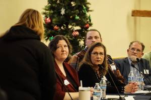 SPiN Cafe board members Valerie Roseberry, Michele Hines, Mark Stroud and David Thorns listen to a comment from Jamie Sherwin at a town hall meeting Wednesday night. (Photo by Sam Fletcher)