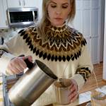(Photo by David Welton)
Lindsay Kelley pours hot wax, infused with the scent of Pear Prosecco, into candle molds.