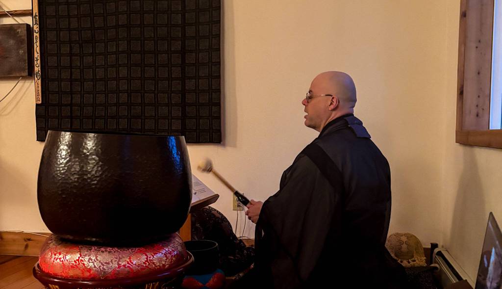 Tendo, head monk at Tahoma One Drop Zen Monastery, leads a Buddhist chant. (Photo by Sam Fletcher)