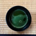 Tendo, head monk at Tahoma One Drop Zen Monastery, serves matcha for a tea ceremony Sunday morning. (Photo by Sam Fletcher)
