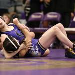 (Photo by John Fisken)
A Wildcat wrestler goes for the pin during a match in December.