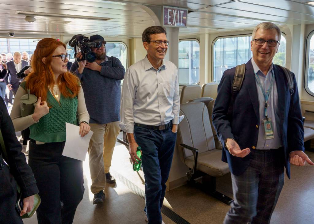 Photo by David Welton
Surrounded by staffers, members of the media and other elected representatives, Bob Ferguson boarded the ferry to Clinton Jan. 8.