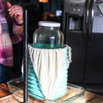 (Photo by Luisa Loi)
The cheese is pressed using a havy jar of water.