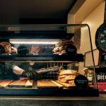 Photo by David Welton
Laura Wills grabs a scone from the case.