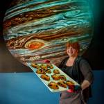 Photo by David Welton
Laura Wills holds a tray of marionberry scones in Jupiter Coffee.