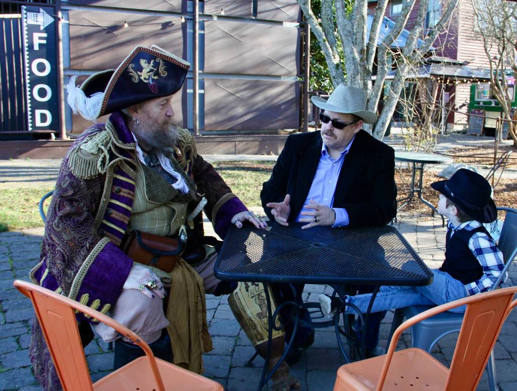 (Photo provided)
Blacky Beardsley, the Gazette Pirate, confers with Joe Curr and Little Joe Curr about selling gambling equipment from the 49ers Club.