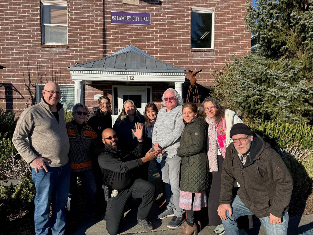 (Photo provided)
City staff gather around Bob Herzberg in front of Langley City Hall.