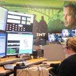 ICOM Dispatcher Kimberli May relies on five computer screens to assist people who call 911 and the first responders. She can see in real time the almost exact location of callers and first responders. (Photo by Luisa Loi)