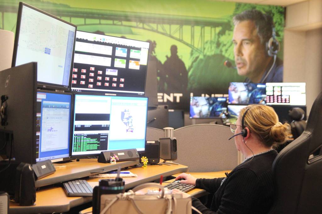 ICOM Dispatcher Kimberli May relies on five computer screens to assist people who call 911 and the first responders. She can see in real time the almost exact location of callers and first responders. (Photo by Luisa Loi)