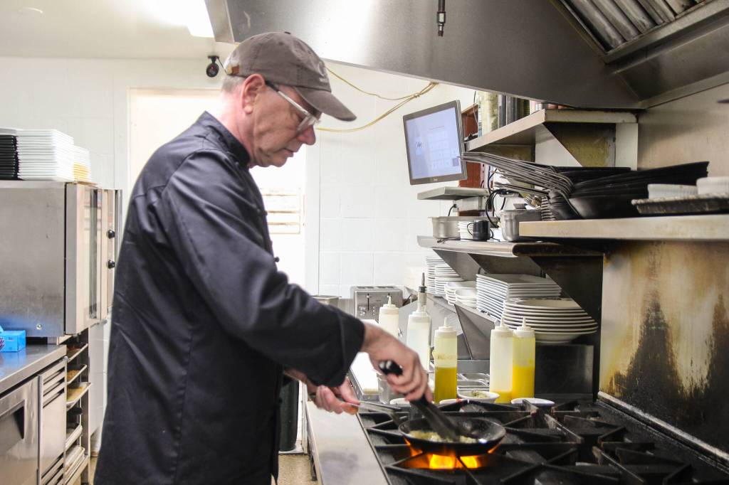 (Photo by Luisa Loi)
Michael Weeks cooks mussels at his restaurant, Callens. Though he does not have a favorite food, he does believe Penn Cove Mussels are among the best.