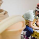 Whidbey Clay Center instructor Jordan Jones demonstrates shaping a lump of clay into a gumdrop shape and centering the hole during her class at the Whidbey Clay Center in Freeland. Centering the holes is an important first step to turn clumps of mud into art, whether it be a mug, bowl, spoon rest, dragon, wagon or farm animal. (Patricia Guthrie / Special to The Herald)