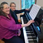 (Photo by Sandy Welch)
Eileen Soskin, front, and Karen Heather at the black and white keys. On March 15, the two skilled pianists will perform their first four-hand concert together.