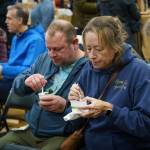 Audience members enjoy some mussels at the Coupeville Recreation Hall, away from the cold. Musselfest also featured the traditional chowder eating contest, which was won by Goldies and the Roost, followed by The Oyster Catcher and Captain Whidbey, according to Musselfest Chair Kellie Sites.