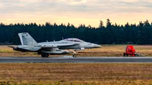 Photo by Joe A. Kunzler | Simple Flying
Tires smoke on a Growler as it makes a touch-and-go landing at the Navy's Outlying Field Coupeville.