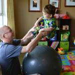 (Photo provided by Steps)
A physical therapist works with a child during a home visit.