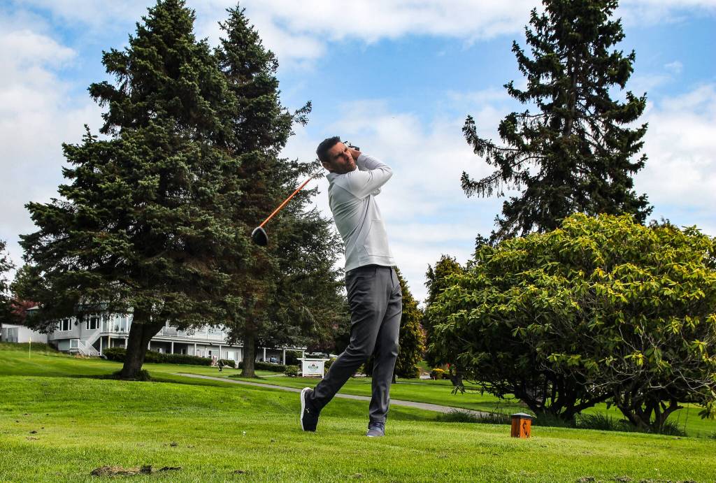 (Photo by Luisa Loi)
Dave Phay shows a News-Times reporter how to play golf at the Whidbey Golf Club. Phay, the head professional golfer at the club, placed second at the Pacific Northwest PGA Professional Championship in Everett, and is now headed to the national PGA competition in Florida.