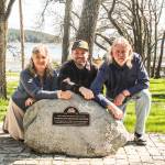 (Photo by Luisa Loi)
At left, Laura Renninger, Kyle Renninger and Brad Gluth pose with the plaque announcing that Smith Park has been placed on the Washington Heritage Register. The plaque, designed by Kyle, will be dedicated with a ceremony on April 12. The granite boulder pays homage to the parks large rocks (naturally deposited there by glaciers), which Laura said came from a single rock that was blown apart with dynamite in the citys early days.