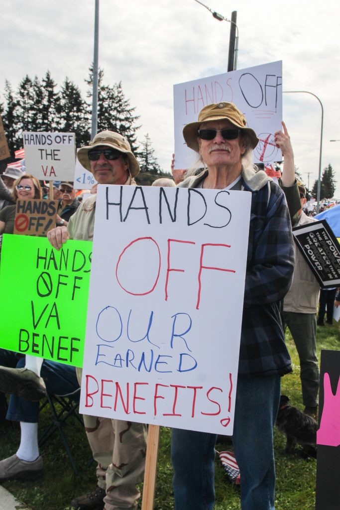 At left, Brian Lavere and Michael Van Voorst protest against the VA staff cuts. (Photo by Luisa Loi)