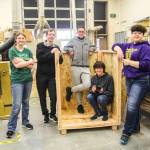 At left, Bella McGinty, Logan Ince, Tristan Nuanez, Tyler Sika and Isabelle Locklear pose by the wooden box in which they later placed Evb0t, which was shipped to Houston that night. (Photo by Luisa Loi)