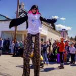 Lindsey Dewey of Clinton dressed up as a whale and walked on stilts as the Mutiny Bay Brass Band played upbeat music for the crowd. (Photo by David Welton)