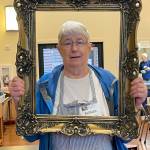 Barb Graham models a picture frame.