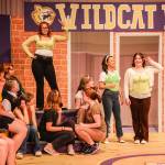 Photos by Luisa Loi
Standing on the stairs of the cafeteria, Martha Cox (Alyza Doctolero) confesses to the school that she enjoys hip-hop dancing. At right, Taylor McKessie and Gabriella Montez (Dana Rivo and Hadley McCulloch).