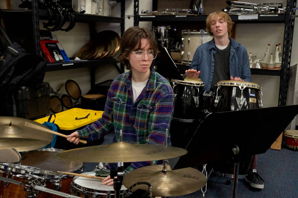 Freshman Luci Helm, left, on the drums and sophomore Solomon Hilliard plays the congas. (Photo by David Welton)