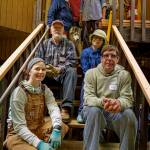 Captain Adam Breedloves team pose on rebuilt steps and railing at Marianne Edain and Steve Ericksons Clinton home.