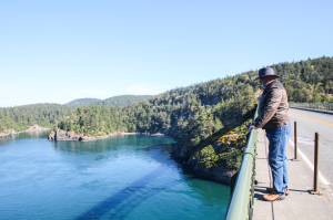 Photo by Luisa Loi
State Sen. Ron Muzzall of Oak Harbor looks over the railing of Deception Pass Bridge.