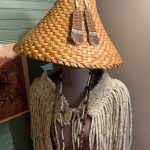 (Photo provided by Langley Historical Museum)
This woven cedar hat was handmade by Carly Mathews (qʷuʔqʷuʔšuliəʔ) and the braided wool cape with copper embellishments was handmade by Pamela Seamonster (čəlalakəm).