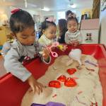 Photo courtesy of Mother Mentors
Sisters Victoria, Valerie and Lillian play together at the Oak Harbor Playscape.