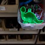 A green dinosaur cookie cutter sticks out of a drawer at the Good Cheer Thrift Store in Langley. (Olivia Vanni / The Herald)