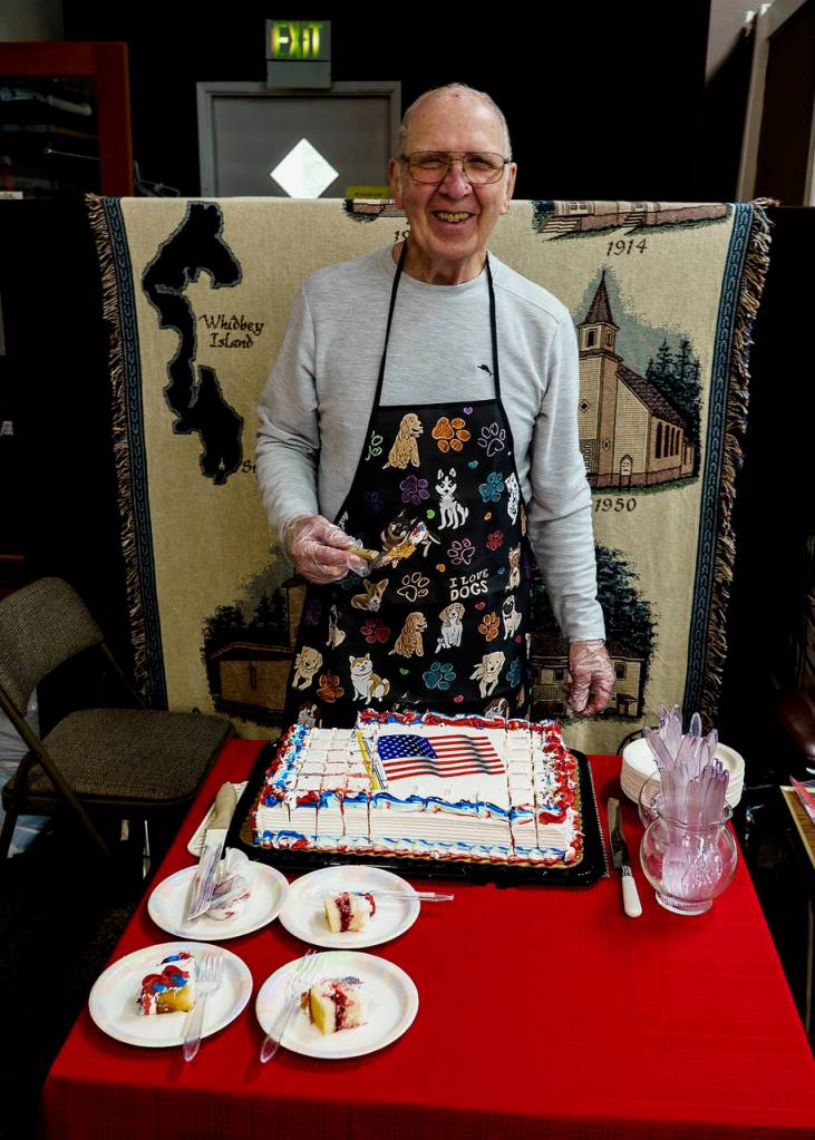 Photo by David Welton
Danny McTighe serves a cake from Payless.
