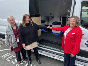 (Photo provided)
From left, Island County Commissioner Melanie Bacon, Jill Johnson and Janet St. Clair present the new mobile outreach van.
