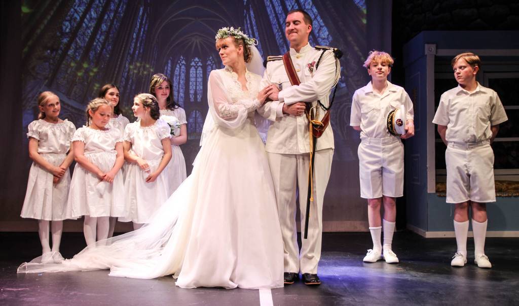 Maria and Georg (Karina Andrew and Jordan Kingma) get married surrounded by their children. From left, Sunny Thuet (Louisa von Trapp), Luna Strong (Gretl von Trapp), Evie Christie (Marta von Trapp). Behond them, at left, Lexi Thuet (Brigitta von Trapp) and Hannah Mayne (Leisl von Trapp). On the right side, at left, Cillian Burke (Friedrich von Trapp) and Rowan McDonald (Kurt von Trapp) (Photo by Luisa Loi)