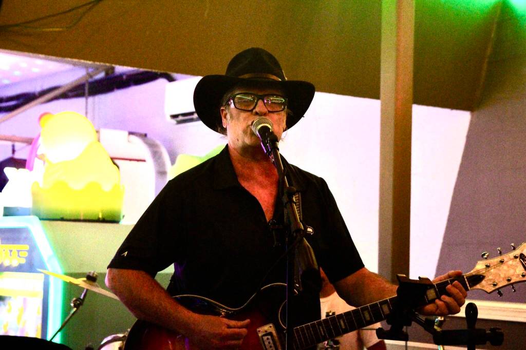 Photo by Marina Blatt
Shawn Cain sings and strums the guitar.