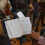 William Skeen with a cello from the 18th century switches his bow from modern to classic (Photo by Allyson Ballard)