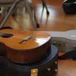 A guitar sits on its case (Photo by Allyson Ballard)