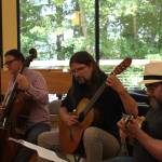Photo by Allyson Ballard. Musicians play Ku'u Pua i Paoakalani written by Hawaiian Queen Lili'uokalani during her inprisonment. From right, Co-director Henry Lebedinsky on the 'ukelele, Kevin Cooper on the guitar, William Skeen on the cello.