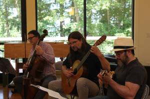 Photo by Allyson Ballard. Musicians play Ku'u Pua i Paoakalani written by Hawaiian Queen Lili'uokalani during her inprisonment. From right, Co-director Henry Lebedinsky on the 'ukelele, Kevin Cooper on the guitar, William Skeen on the cello.