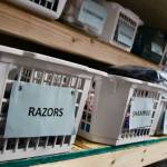 Boxes of razors, conditioner, shave cream and other feminine hygiene products at the warehouse (Photo by Marina Blatt)