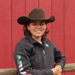 Rhed Locke poses in front of her barn (Photo by Allyson Ballard)