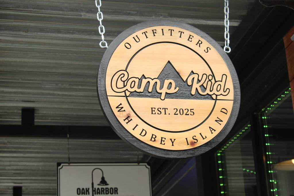 Camp Kids outdoorsy sign, hanging above the stores entry (Photo by Allyson Ballard)