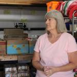 Jean Wieman stands in the Help Houses warehouse (Photo by Allyson Ballard)