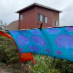 Dyed fabrics flap in the wind. The class explores what happens when color is repeatedly added and removed through sequential shibori techniques (Photo by Matt Neinhuis)