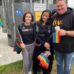 Councilmember Tara Hizon, organizer Ameina Qazi, and Mayor Ronnie Wright celebrate at Flintstone Park before Oak Harbors first Pride Walk. (Photo by Bill Walker)