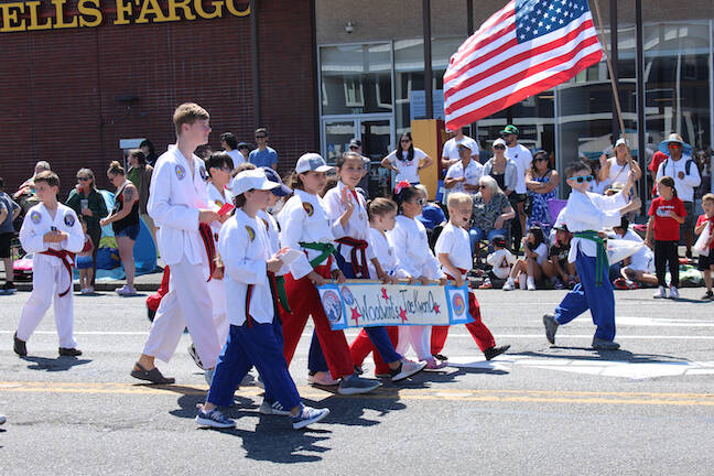 Young taekwondo practitioners march in the parade (Photo by Allyson Ballard)